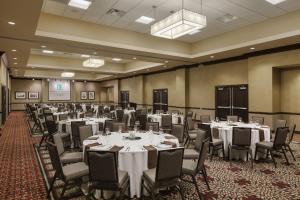 a banquet room with tables and chairs in a room at Embassy Suites Saint Louis - Downtown in Saint Louis