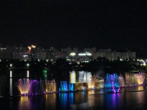 a group of water fountains in the water at night at 호텔뷰 in Tomin-dong