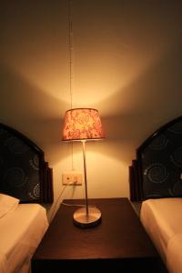 Postel nebo postele na pokoji v ubytování Chaba Chalet Hotel