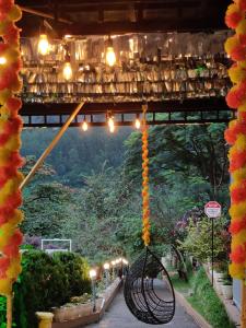 a view of a garden with lights and plants at Koodaram Camping Munnar in Munnar