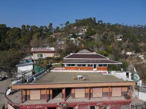 an aerial view of a building with a tennis court at Burj Resort in Ban +15 photos