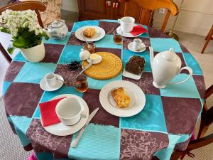 a table with plates of food on top of it at Le temps des Pins in La Teste-de-Buch