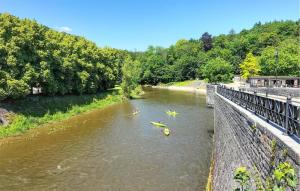 a group of people kayaking down a river at 2 Bedroom Nice Home In Rendeux in Rendeux +12 photos