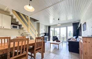 a kitchen and living room with a table and chairs at 2 Bedroom Nice Home In Rendeux in Rendeux