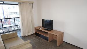 TV at/o entertainment center sa Via Venneto Flat