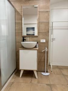 a bathroom with a sink and a mirror at A Casuzza di Giú Giú - NUOVA GESTIONE in Agrigento +25 photos