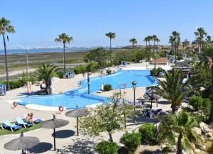 an aerial view of a pool at a resort at Sonsoles Apartamentos Bahía Sur in San Fernando