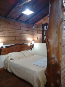 מיטה או מיטות בחדר ב-Cabañas Lignum - Tiny House