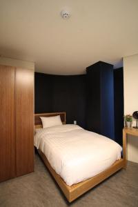 Postel nebo postele na pokoji v ubytování Nabi Hostel
