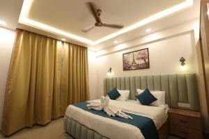 a bedroom with a bed with an animal on it at Navrasa By CDF in Vrindāvan