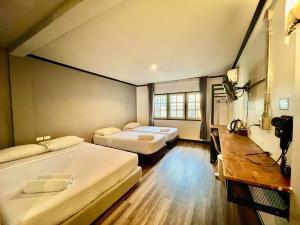 Кровать или кровати в номере Pimpimarn Hotel +41 фотография
