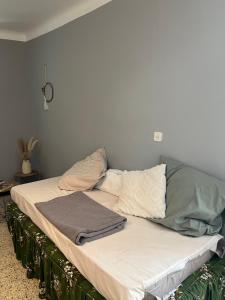a bed with blankets and pillows on top of it at Dumas St-Germain de calberte in Saint-Germain-de-Calberte