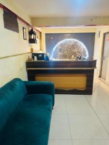 a living room with a couch and a counter at Hotel Lake View in Varanasi