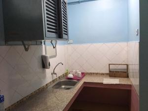 a small kitchen with a sink and a window at Zleep63 in Bangkok +73 photos