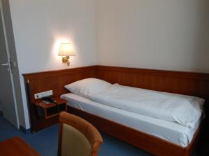 Voodi või voodid majutusasutuse Hotel Pfeffermühle toas