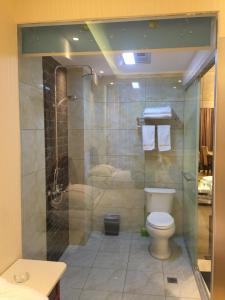 Koupelna v ubytování Bai Nian Sheng Shi Hotel