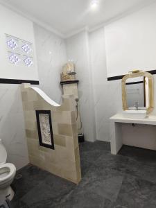 a bathroom with a toilet and a sink at Villa Bagus in Lovina +39 photos
