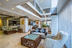 a lobby of a hotel with couches and chairs at Mevre Hotel in Antalya