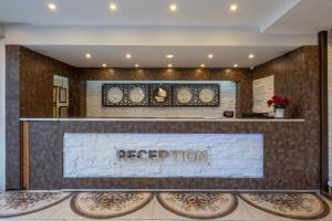 a reception area of a hotel with a reception desk at Mevre Hotel in Antalya