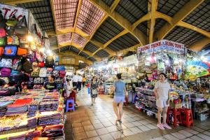 a group of people walking around a market in a store at Lunaria Maison - HCM Center Stay in Ho Chi Minh City