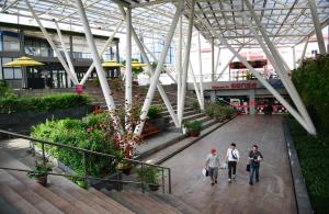 a group of people walking through a shopping mall at Lunaria Maison - HCM Center Stay in Ho Chi Minh City