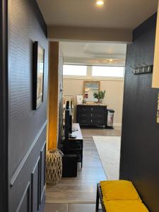 an office with a hallway with a desk and a room at Relaxed appartment in Melun +20 photos