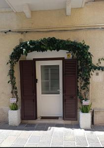 a entrance to a building with a white door at Sweet Home in Termoli