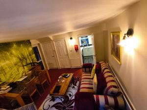a living room with a couch and a table at No6 High Street in Edwinstowe
