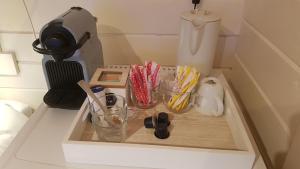 a kitchen counter with a tray with cups and utensils at Studio QuaAmsterdam in Amsterdam