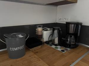 a kitchen with a counter with two coffee makers on it at Studio en baie de Somme in Villers-sur-Authie +4 photos