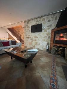 a living room with a couch and a fireplace at Casa del Tío Marcelo in Pedraza-Segovia