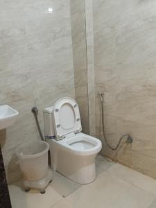 a bathroom with a toilet and a sink at Hotel Viny villa in Udaipur