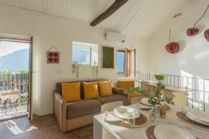 a living room with a couch and a table at La Casa di Pietro in Blevio