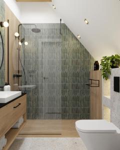 a bathroom with a shower with a toilet and a sink at Prime - Event & Relax Resort in Jaszczurowa +39 photos