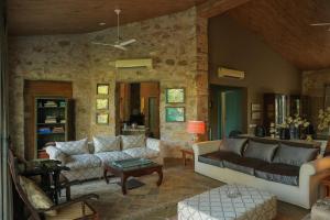 a living room with a couch and a table at 5 Bedroom Villa Amer in Jaipur