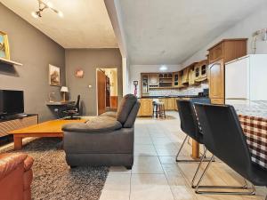 a living room with a couch and a table at Sliema 3 bedrooms apartment in Sliema