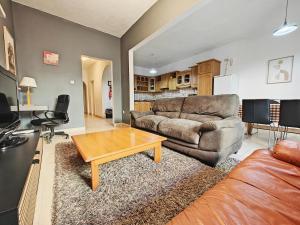 a living room with a couch and a coffee table at Sliema 3 bedrooms apartment in Sliema