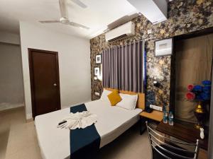 a bedroom with a bed in a room at hotel Prime Plaza Newtown in kolkata