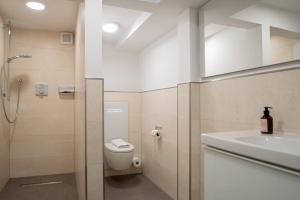 a bathroom with a toilet and a sink at Inselrose in Juist