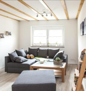 a living room with a couch and a coffee table at Ferienwohnung Leppert in Schwanau