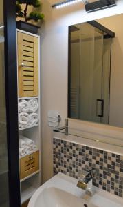 a bathroom with a sink and a mirror at Champ De Foire in Sussac +34 photos
