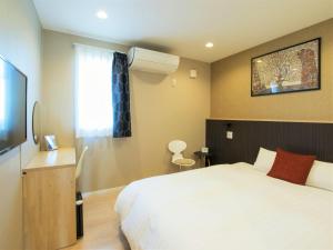 Katil atau katil-katil dalam bilik di North Gate Inn ABIRA