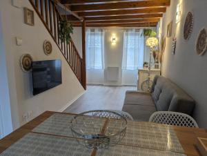 a living room with a couch and a table at Cozy AM Spa and Cinema in Andance