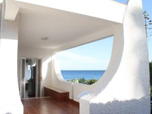 a house with a view of the ocean at Belvilla by OYO Villa Eirene in Fontane Bianche