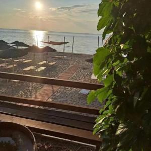 a view of a beach with umbrellas and the ocean at Rooms To Let Giannis in Makrygialos