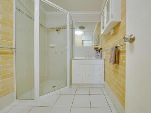 a bathroom with a shower and a sink at Murray Street Apartments in Rockhampton