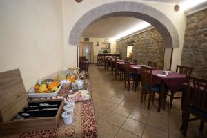 a dining room with tables and chairs in a restaurant at Hotel Gangi in Piazza Armerina +53 photos