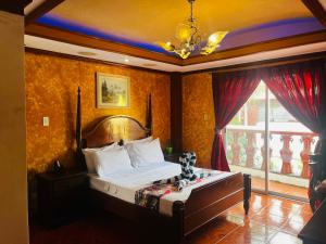 a bedroom with a bed and a large window at PALM TREE RESORT AND RESTAURANT in Olongapo +45 photos