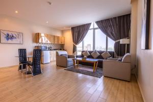 a living room with a couch and a table at Al Muhaidb Residence Al Malaz 4 - Economic in Riyadh