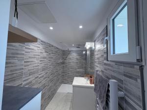 a bathroom with a sink and a window at Lodge La Forêt in Les Sables-d'Olonne +17 photos